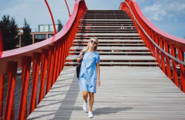 beautiful girl blue dress posing bridge